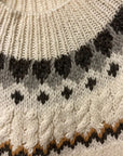 Hand knitting Nordic poncho